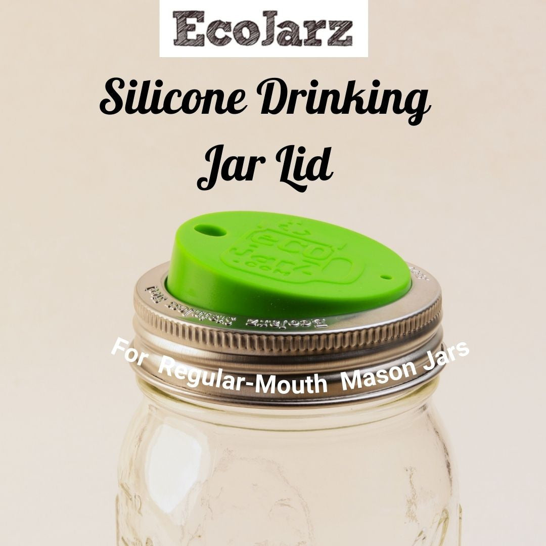 A green silicone drinking lid screwed onto a regular mouth mason jar.