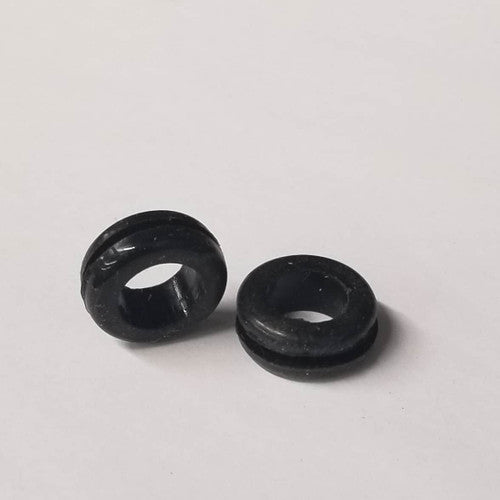 two small black rubber grommets