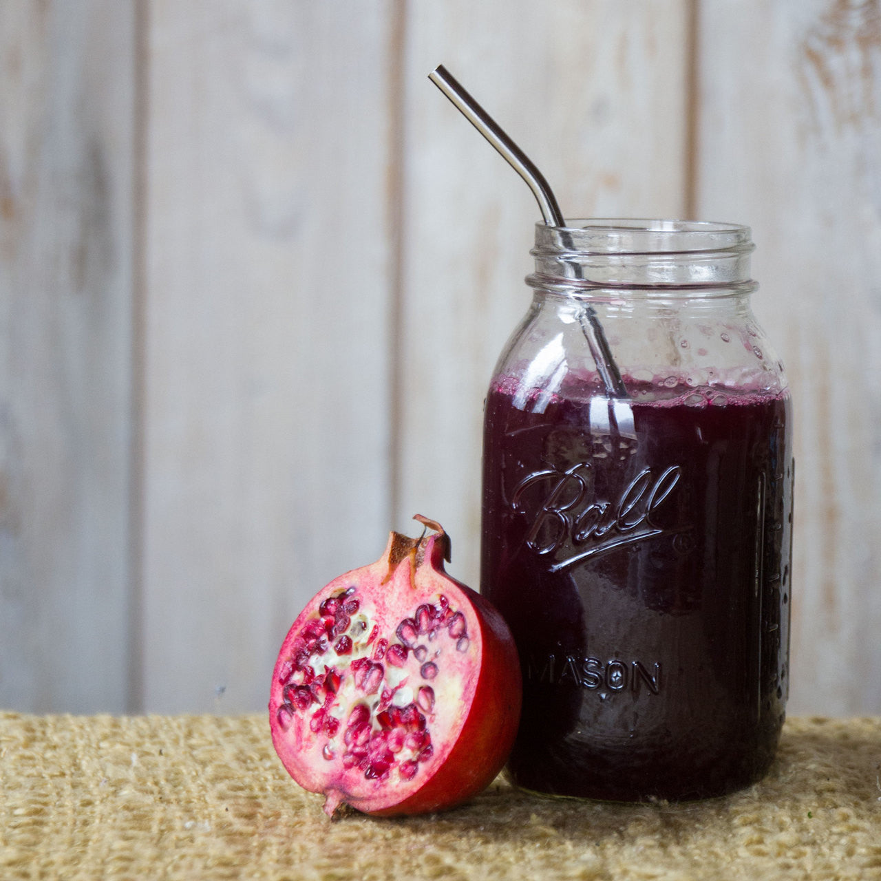 Classic Bent Straw in a mason jar full of juice.