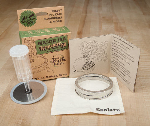 fermenter kit brown retail box, a fermenting guide booklet, stainless steel jar band, cloth, plastic airlock, and a stainless steel lid with a hole