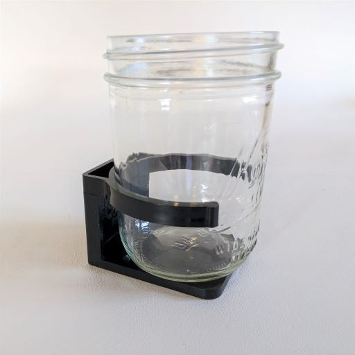 an ecojarz jar clip holding a 16 ounce wide mouth mason jar