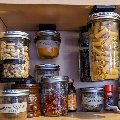 save space in a pantry by hanging mason jars with the jar clip