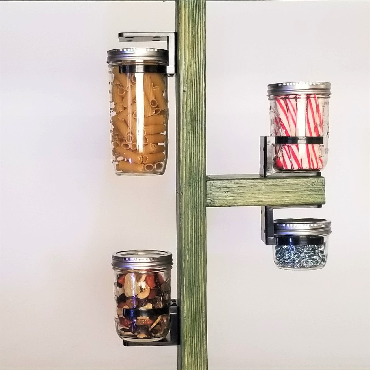 Mason jars hanging from a shelf or on a wall with the jar clip.