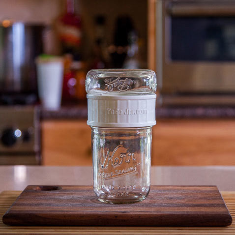 a wide mouth togojar connecting a 16 oz wide mouth mason jar to a 8 oz wide mouth mason jar